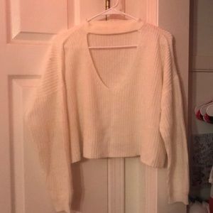 White sweater with large V- neck in the front :))